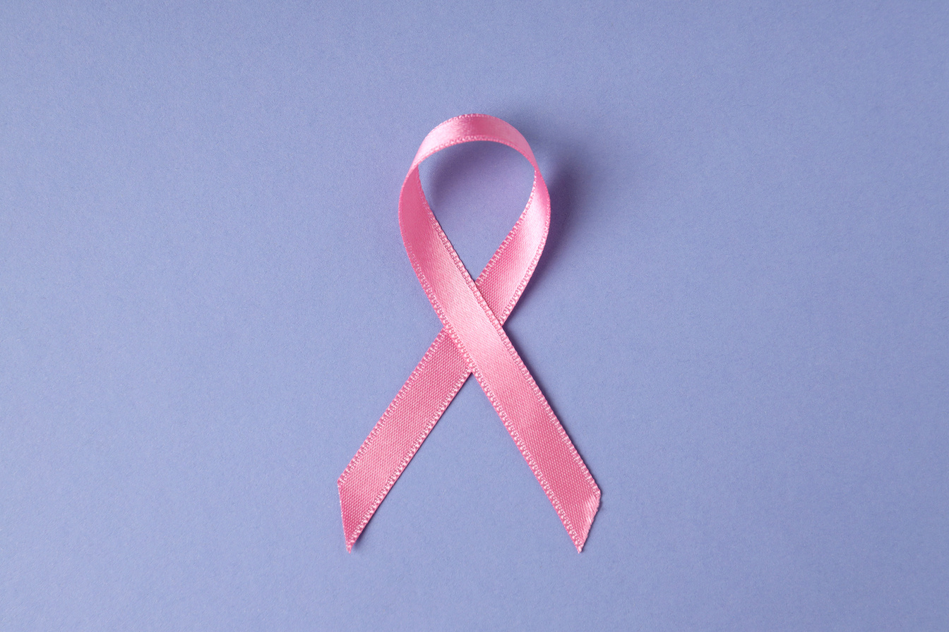 Breast Cancer Awareness Ribbon on Violet Background
